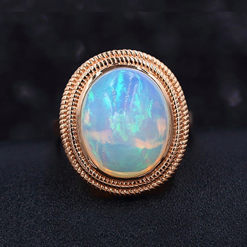 14k Gold 6.65 Ct Natural Opal Ring: Ref:231034316 // gold content:14k gold // ring size:7. 25us // // main gemstone:opal // shape:oval // carat weight:6. 65ct // color:color // treatment:natural // Condition: New Low Estimate: 2200.00