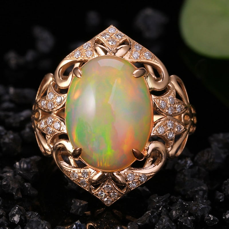 14k Gold 4.15 Ctw Natural Opal & Diamond Ring: Ref:231034317 // gold content:14k gold // ring size:7. 25us // // main gemstone:opal // shape:oval // carat weight:3. 97ct // color:color // treatment:natural // // adjacent gemstone 2 : diamond //