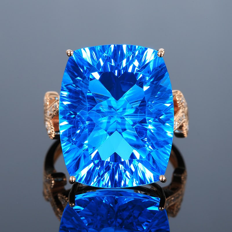 14k Gold 22.29 Ct Natural Topaz & Diamond Ring: Ref:231034332 // gold content:14k gold // ring size:7. 25us // // main gemstone:topaz // shape:cushion // carat weight:22. 29ct // color:blue // treatment:natural // // adjacent gemstone 2 : diamond /