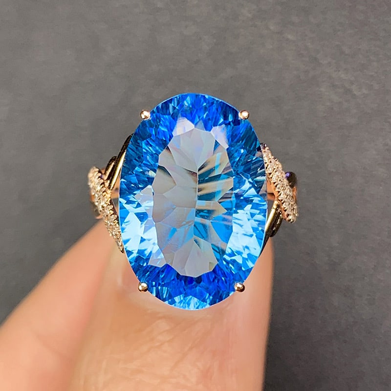 14k Gold 12.06 Ct Natural Topaz & Diamond Ring: Ref:231034334 // gold content:14k gold // ring size:7. 25us // // main gemstone:topaz // shape:oval // carat weight:12. 06ct // color:blue // treatment:natural // // adjacent gemstone 2 : diamond //