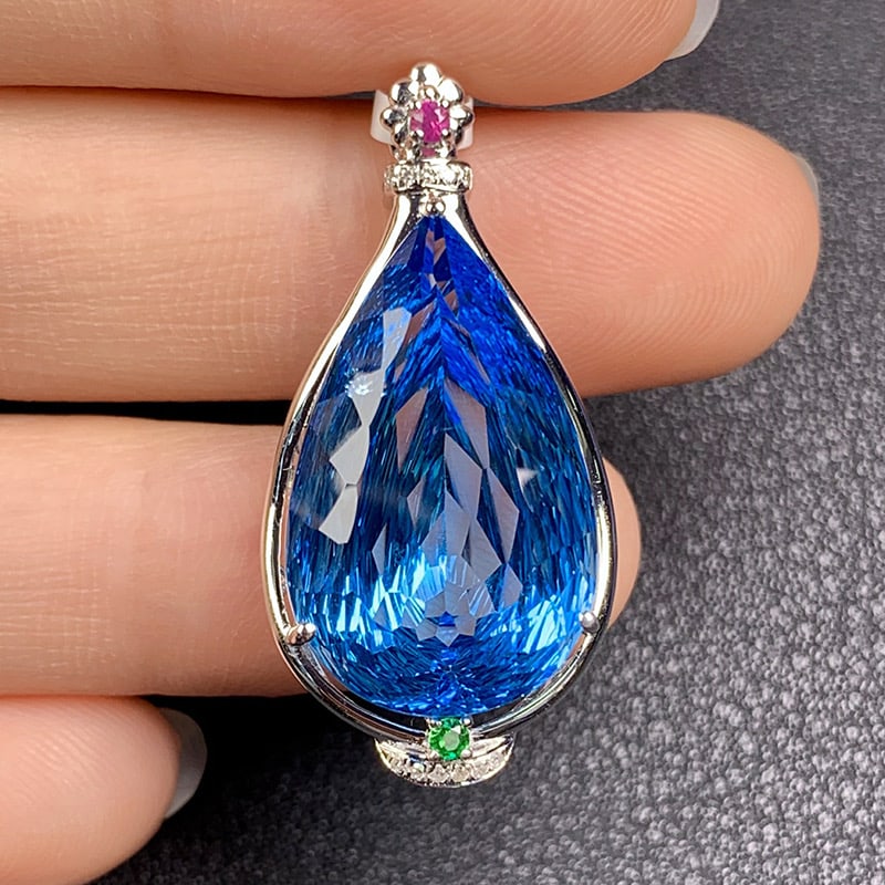 14k Gold 17.41 Ct Natural Topaz & Diamond & Ruby & Tsavorite Pendant( Without Chain ): Ref:231034335 // gold content:14k gold // main gemstone:topaz // shape:pear // carat weight:17. 41ct // color:blue // treatment:natural // // adjacent gemstone 2 : diamond // shape:round // clarity
