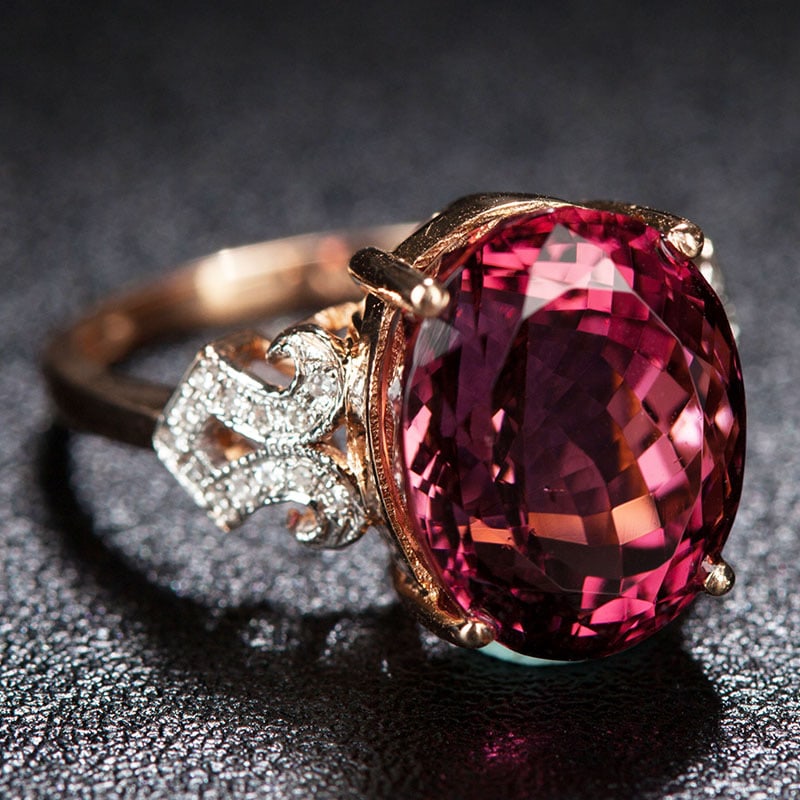 14k Gold 8.45 Ct Natural Tourmaline & Diamond Ring: Ref:231034345 // gold content:14k gold // ring size:7. 25us // // main gemstone:tourmaline // shape:oval // carat weight:8. 45ct // color:red // treatment:natural // // adjacent gemstone 2 : diamond