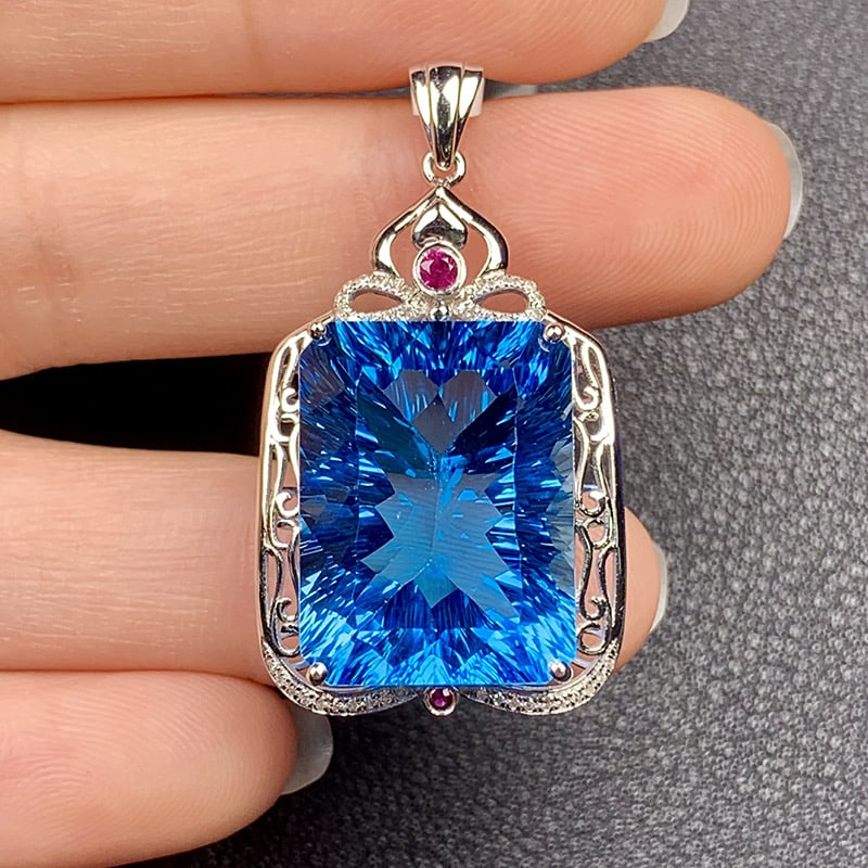 14k Gold 29.09 Ct Natural Topaz & Diamond & Ruby Pendant( Without Chain ): Ref:231034401 // gold content:14k gold // main gemstone:topaz // shape:octagonal // carat weight:29. 09ct // color:blue // treatment:natural // // adjacent gemstone 2 : diamond // shape:round //