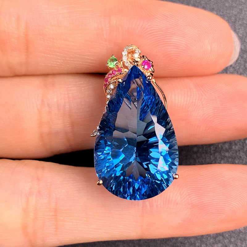 14k Gold 19.80 Ct Natural Topaz & Diamond Ring: Ref:231034402 // gold content:14k gold // ring size:7. 25us // // main gemstone:topaz // shape:pear // carat weight:19. 80ct // color:blue // treatment:natural // // adjacent gemstone 2 : diamond //