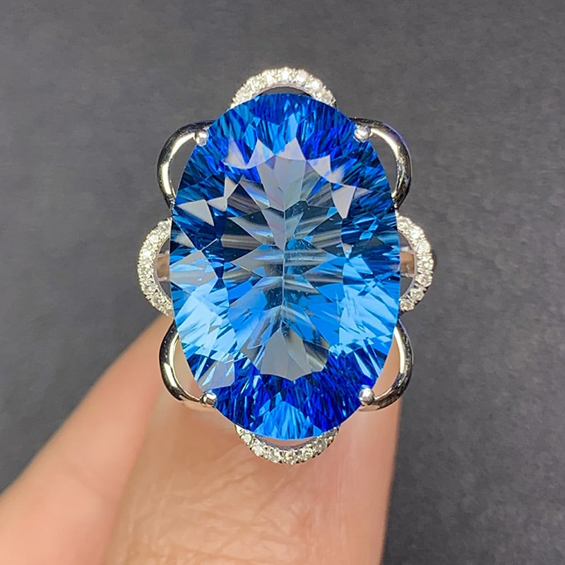 14k Gold 16.33 Ct Natural Topaz & Diamond Ring: Ref:231034403 // gold content:14k gold // ring size:7. 25us // // main gemstone:topaz // shape:oval // carat weight:16. 33ct // color:blue // treatment:natural // // adjacent gemstone 2 : diamond //
