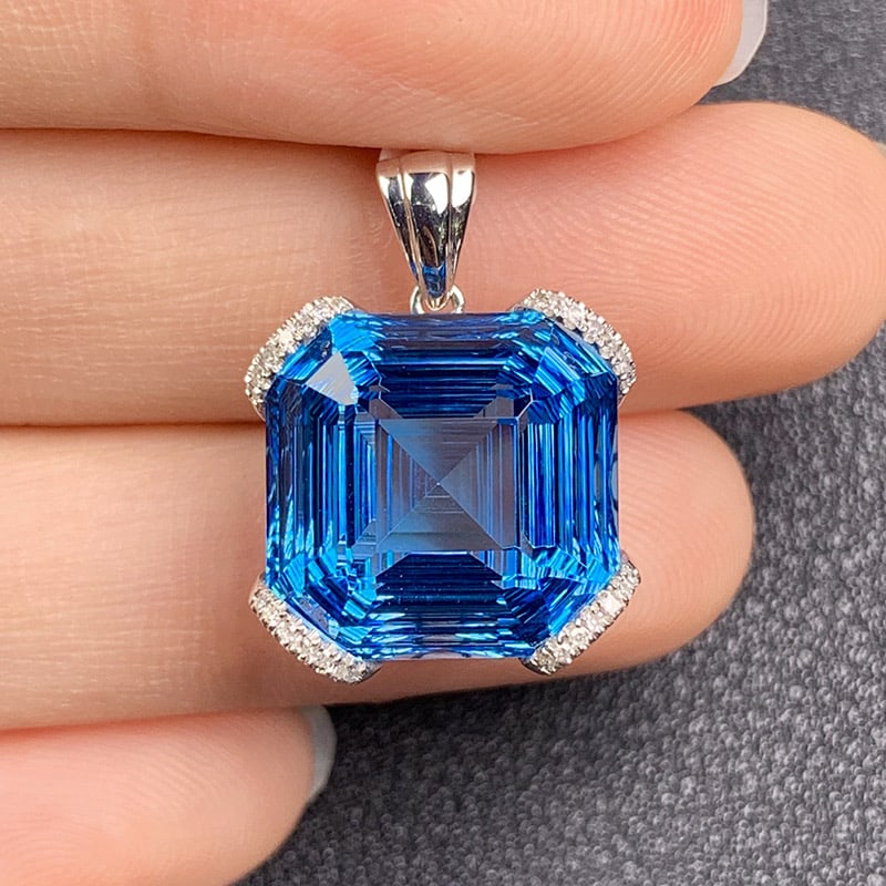 14k Gold 19.00 Ct Natural Topaz & Diamond Pendant( Without Chain ): Ref:231034406 // gold content:14k gold // main gemstone:topaz // shape:octagonal // carat weight:19. 00ct // color:blue // treatment:natural // // adjacent gemstone 2 : diamond // shape:round //