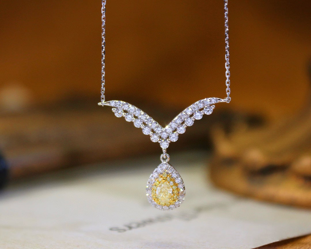14k Gold 0.58 Ctw Natural Yellow Diamond & Diamond Necklace: Ref:231034420 // gold content:14k gold // main gemstone:yellow diamond // shape:pear // carat weight:0. 20ct // color:yellow // treatment:natural // // adjacent gemstone 2 : diamond // shape:round // 