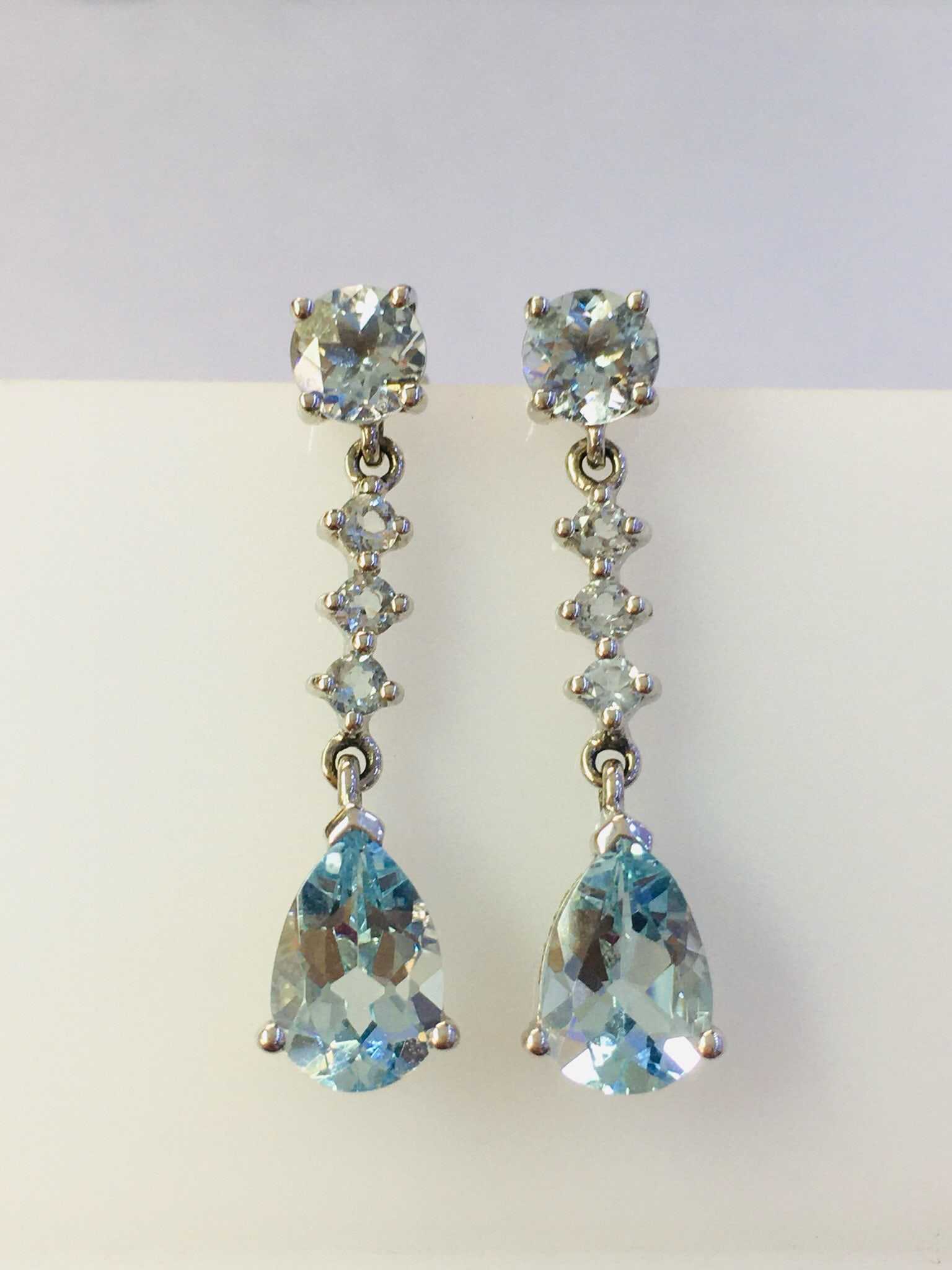 14k Gold 2.41 Ct Natural Aquamarine Earrings: Ref:231034440 // gold content:14k gold // main gemstone:aquamarine // shape:pear // carat weight:2. 41ct // color:blue // treatment:natural // Condition: New Low Estimate: 2400.00 High Estimate: