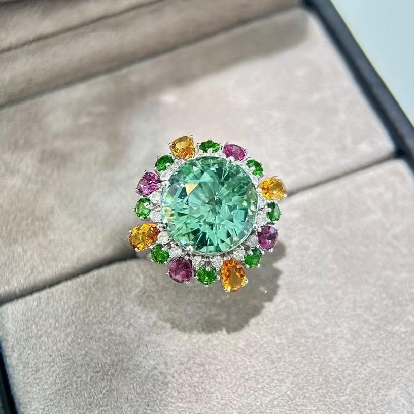 14k Gold 11.39 Ctw Natural Tourmaline & Coloured Gemstone Ring: Ref:231035022 // gold content:14k gold // ring size:7. 25us // // main gemstone:tourmaline // shape:round // carat weight:9. 1ct // color:green // treatment:natural // cut grade:g // // adjacent gemst