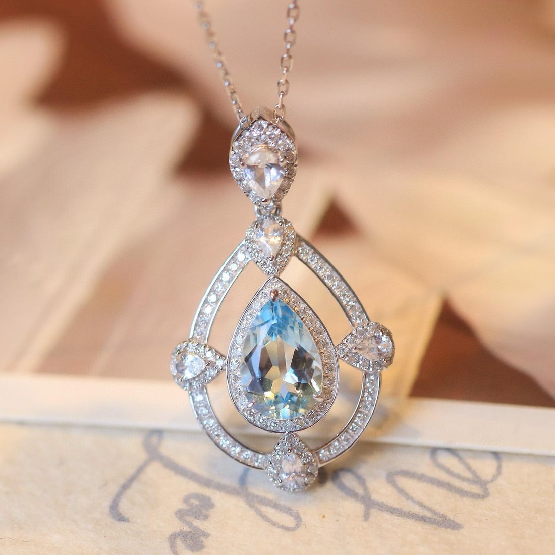 14k Gold 1.59 Ctw Natural Aquamarine & Diamond Pendant( Without Chain ): Ref:231035027 // gold content:14k gold // main gemstone:aquamarine // shape:pear // carat weight:1. 2ct // color:blue // treatment:natural // // adjacent gemstone 2 : diamond // shape:round // carat