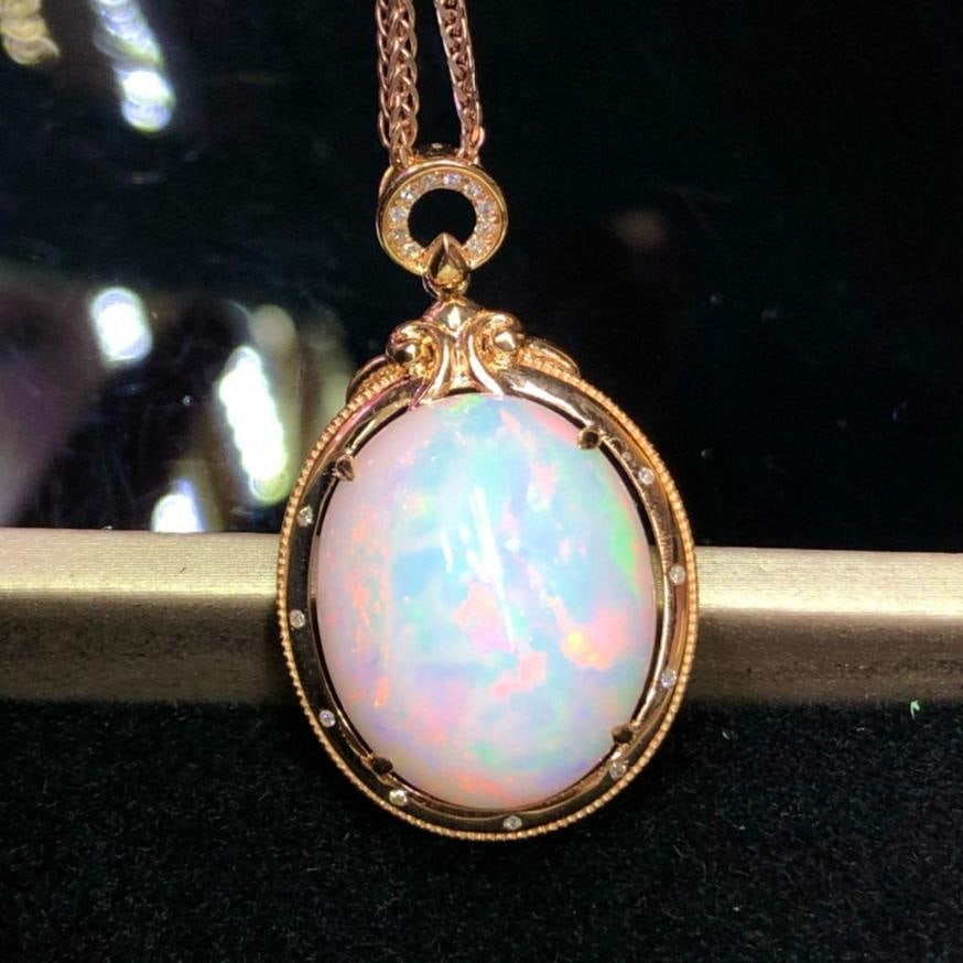 14k Gold 12.85 Ct Natural Opal & Diamond Pendant( Without Chain ): Ref:231035052 // gold content:14k gold // main gemstone:opal // shape:oval // carat weight:12. 85ct // color:white // treatment:natural // // adjacent gemstone 2 : diamond // number of stones:19 //