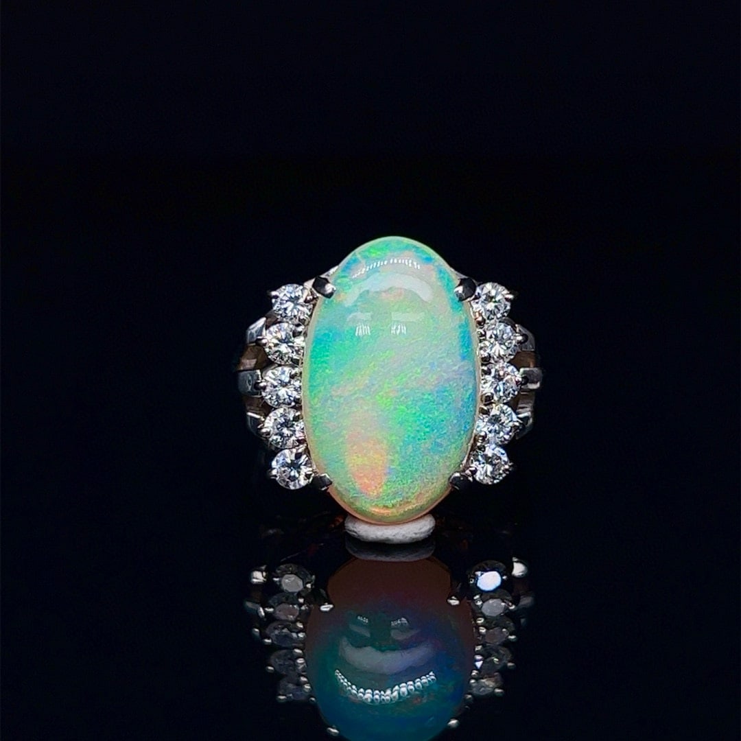 14k Gold 5.56 Ctw Natural Opal & Diamond Ring: Ref:231035054 // gold content:14k gold // ring size:7. 25us // // main gemstone:opal // shape:oval // carat weight:4. 98ct // color:color // treatment:natural // // adjacent gemstone 2 : diamond // sh