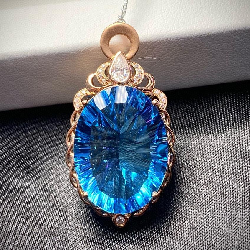 14k Gold 21.2 Ct Natural Topaz & Diamond Pendant( Without Chain ): Ref:231035102 // gold content:14k gold // main gemstone:topaz // shape:oval // carat weight:21. 2ct // color:blue // treatment:natural // // adjacent gemstone 2 : diamond // number of stones:18 //