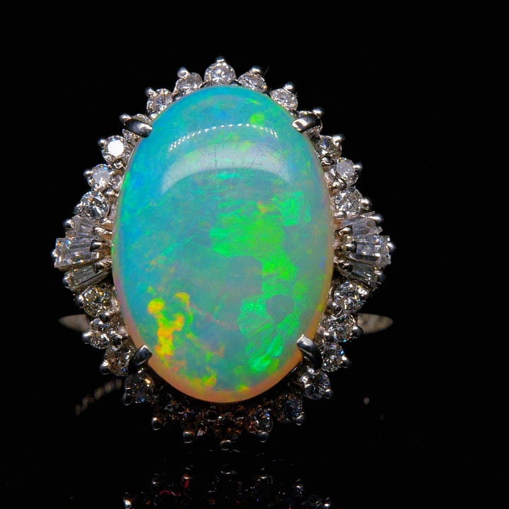 14k Gold 4.88 Ctw Natural Opal & Diamond Ring: Ref:231035120 // gold content:14k gold // ring size:7. 25us // // main gemstone:opal // shape:oval // carat weight:4. 4ct // color:color // treatment:natural // // adjacent gemstone 2 : diamond // sha
