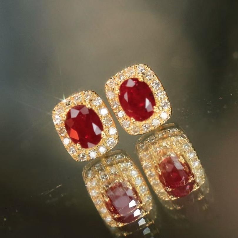 14k Gold 0.56 Ctw Natural Ruby & Diamond Earrings: Ref:231035125 // gold content:14k gold // main gemstone:ruby // shape:oval // carat weight:0. 44ct // color:red // treatment:natural // // adjacent gemstone 2 : diamond // shape:round // carat weight: