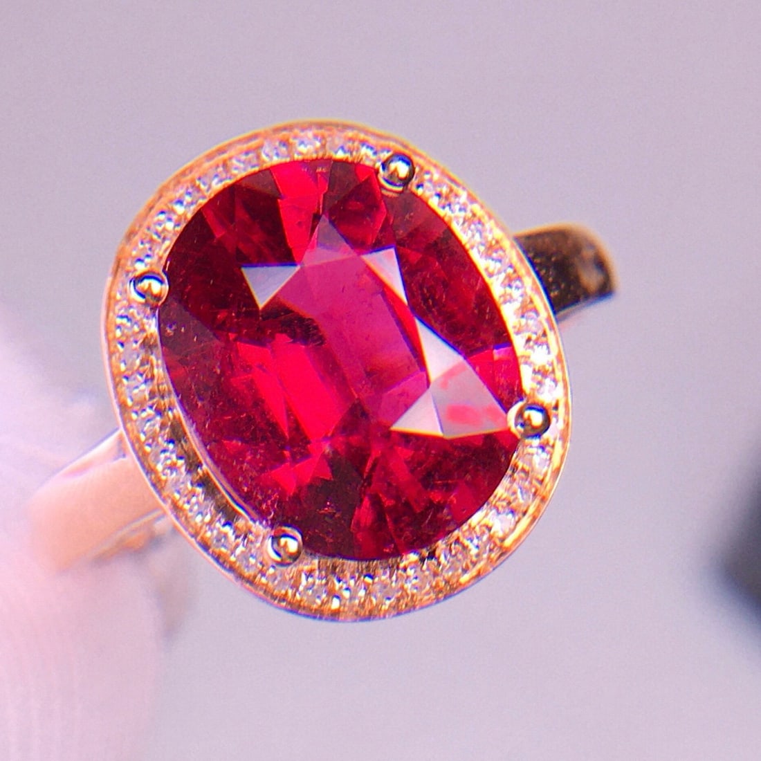 14k Gold 3.2 Ct Natural Tourmaline & Diamond Ring: Ref:231035129 // gold content:14k gold // ring size:7. 25us // // main gemstone:tourmaline // shape:oval // carat weight:3. 2ct // color:red // treatment:natural // // adjacent gemstone 2 : diamond