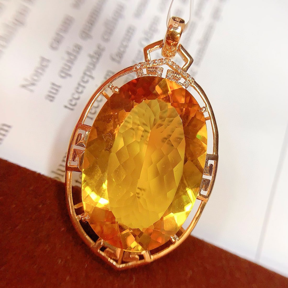14k Gold 26.36 Ct Natural Citrine & Diamond Pendant( Without Chain ): Ref:231035143 // gold content:14k gold // main gemstone:citrine // shape:oval // carat weight:26. 36ct // color:yellow // treatment:natural // // adjacent gemstone 2 : diamond // number of stones:20