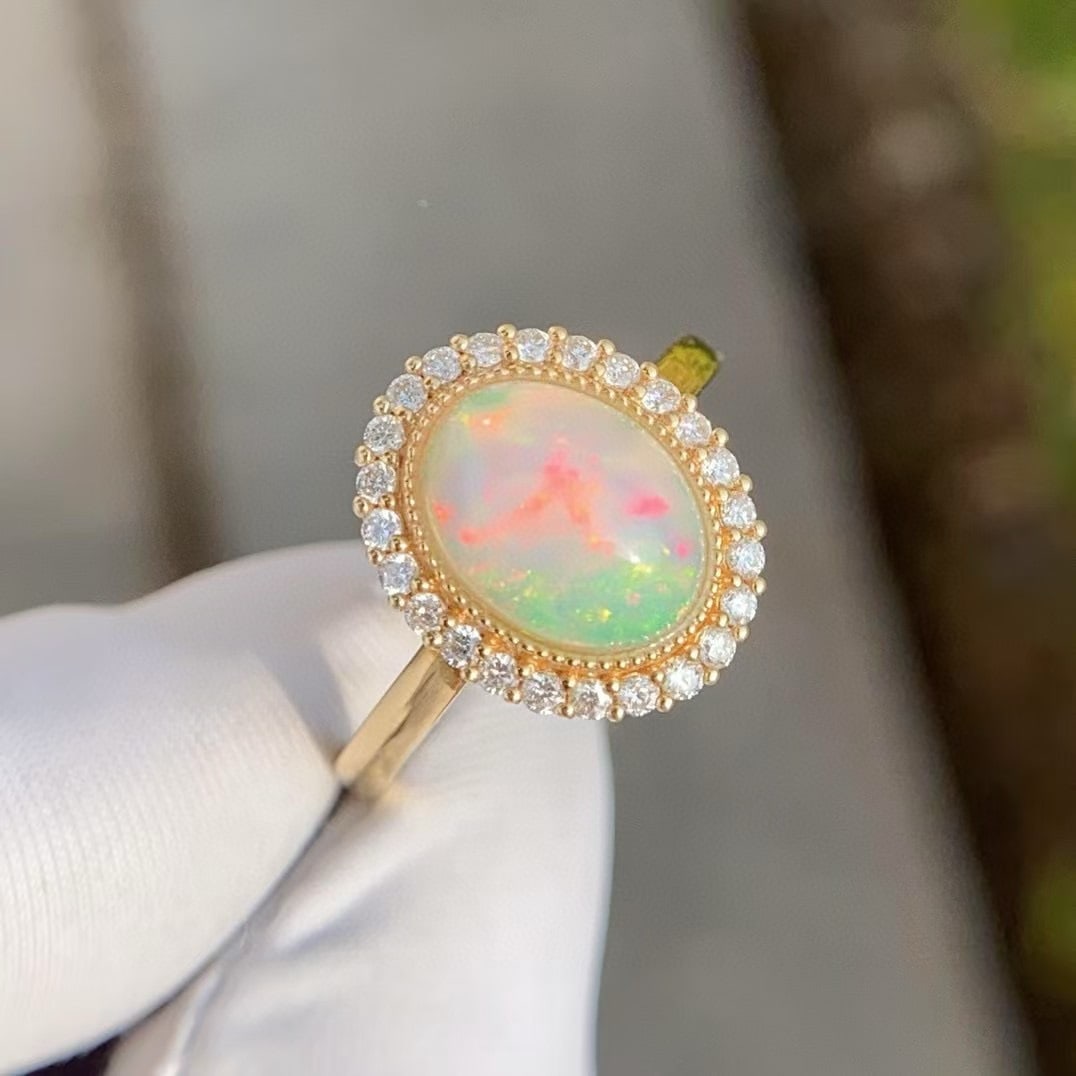 14k Gold 2 Ct Natural Opal & Diamond Ring: Ref:231035156 // gold content:14k gold // ring size:7. 25us // // main gemstone:opal // shape:oval // carat weight:2ct // color:white // treatment:natural // // adjacent gemstone 2 : diamond //