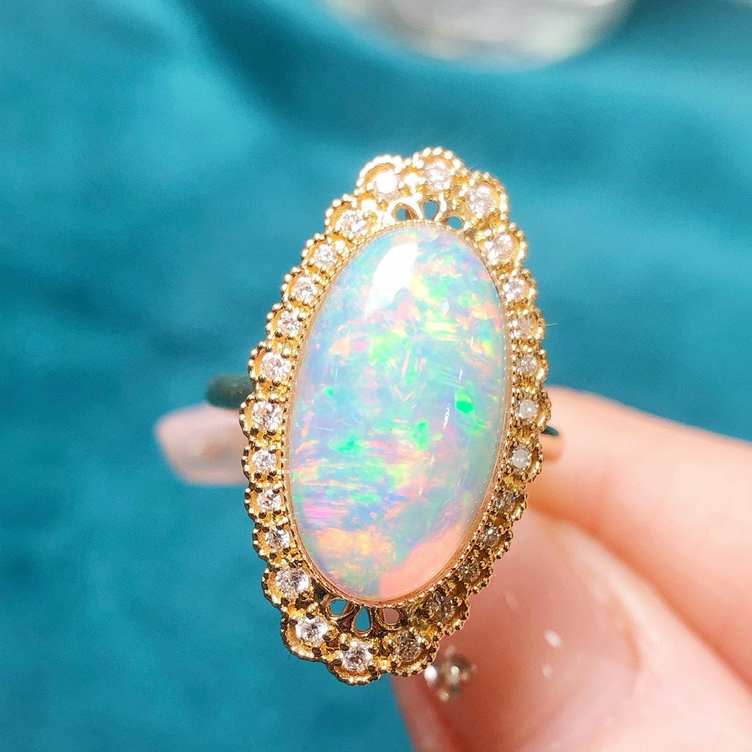 14k Gold 3.94 Ctw Natural Opal & Diamond Ring: Ref:231035157 // gold content:14k gold // ring size:7. 25us // // main gemstone:opal // shape:oval // carat weight:3. 64ct // color:white // treatment:natural // // adjacent gemstone 2 : diamond //