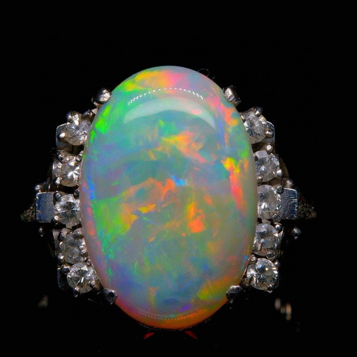 14k Gold 3.4 Ct Natural Opal & Diamond Ring: Ref:231035161 // gold content:14k gold // ring size:7. 25us // // main gemstone:opal // shape:oval // carat weight:3. 4ct // color:color // treatment:natural // // adjacent gemstone 2 : diamond //