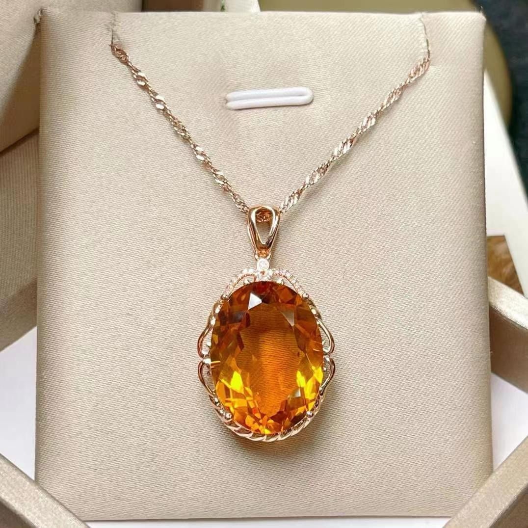 14k Gold 16.50 Ctw Natural Citrine & Diamond Pendant( Without Chain ): Ref:231035206 // gold content:14k gold // main gemstone:citrine // shape:oval // carat weight:16. 45ct // color:yellow // treatment:natural // // adjacent gemstone 2 : diamond // number of stones:17