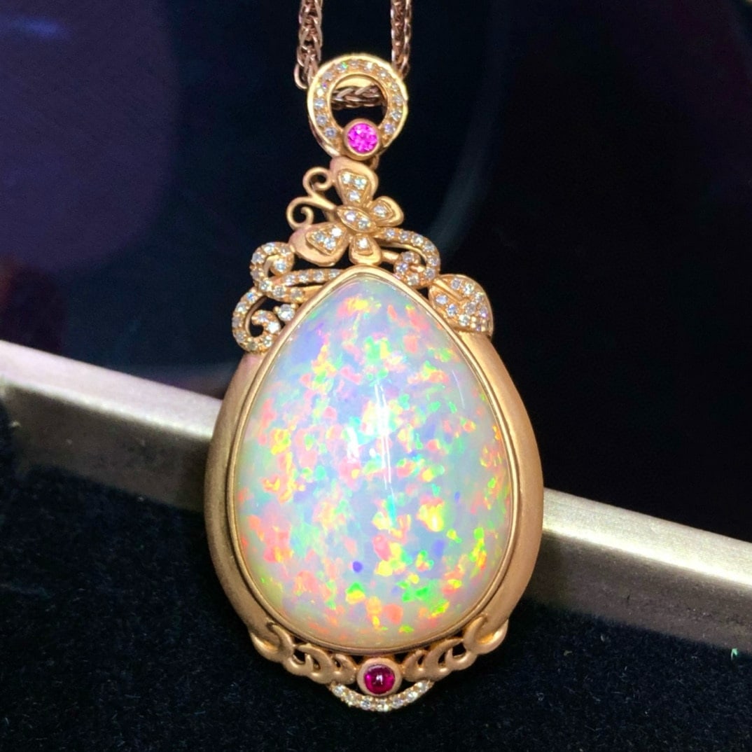 14k Gold 33.2 Ct Natural Opal & Diamond Pendant( Without Chain ): Ref:231035235 // gold content:14k gold // main gemstone:opal // shape:pear // carat weight:33. 2ct // color:white // treatment:natural // // adjacent gemstone 2 : diamond // number of stones:70 // sha
