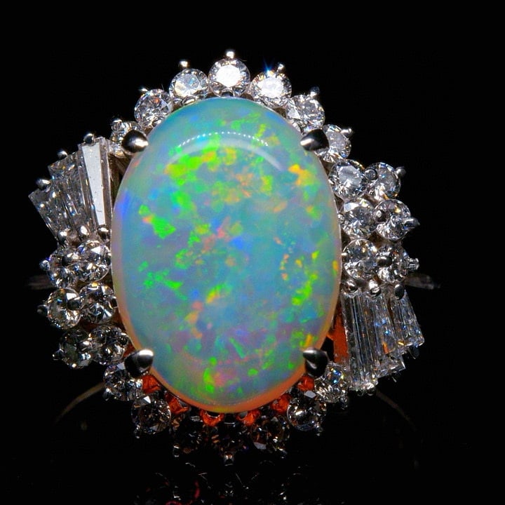 14k Gold 3.92 Ctw Natural Opal & Diamond Ring: Ref:231035238 // gold content:14k gold // ring size:7. 25us // // main gemstone:opal // shape:oval // carat weight:3. 14ct // color:color // treatment:natural // // adjacent gemstone 2 : diamond // sh