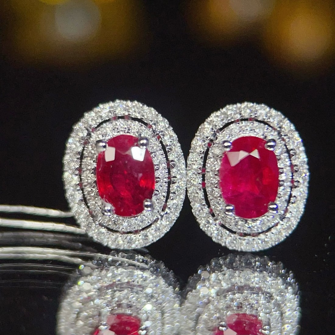 14k Gold 1.26 Ct Natural Ruby & Diamond Earrings: Ref:231036046 // gold content:14k gold // main gemstone:ruby // shape:oval // carat weight:1. 26ct // color:red // treatment:natural // // adjacent gemstone 2 : diamond // number of stones:88 //