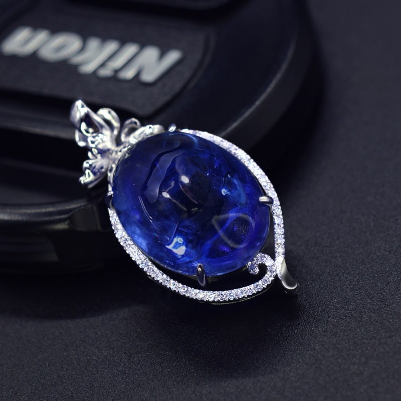 14k Gold 16.53 Ctw Natural Tanzanite & Diamond Pendant( Without Chain ): Ref:231036089 // gold content:14k gold // main gemstone:tanzanite // shape:oval // carat weight:16. 39ct // color:blue // treatment:natural // // adjacent gemstone 2 : diamond // number of stones:47