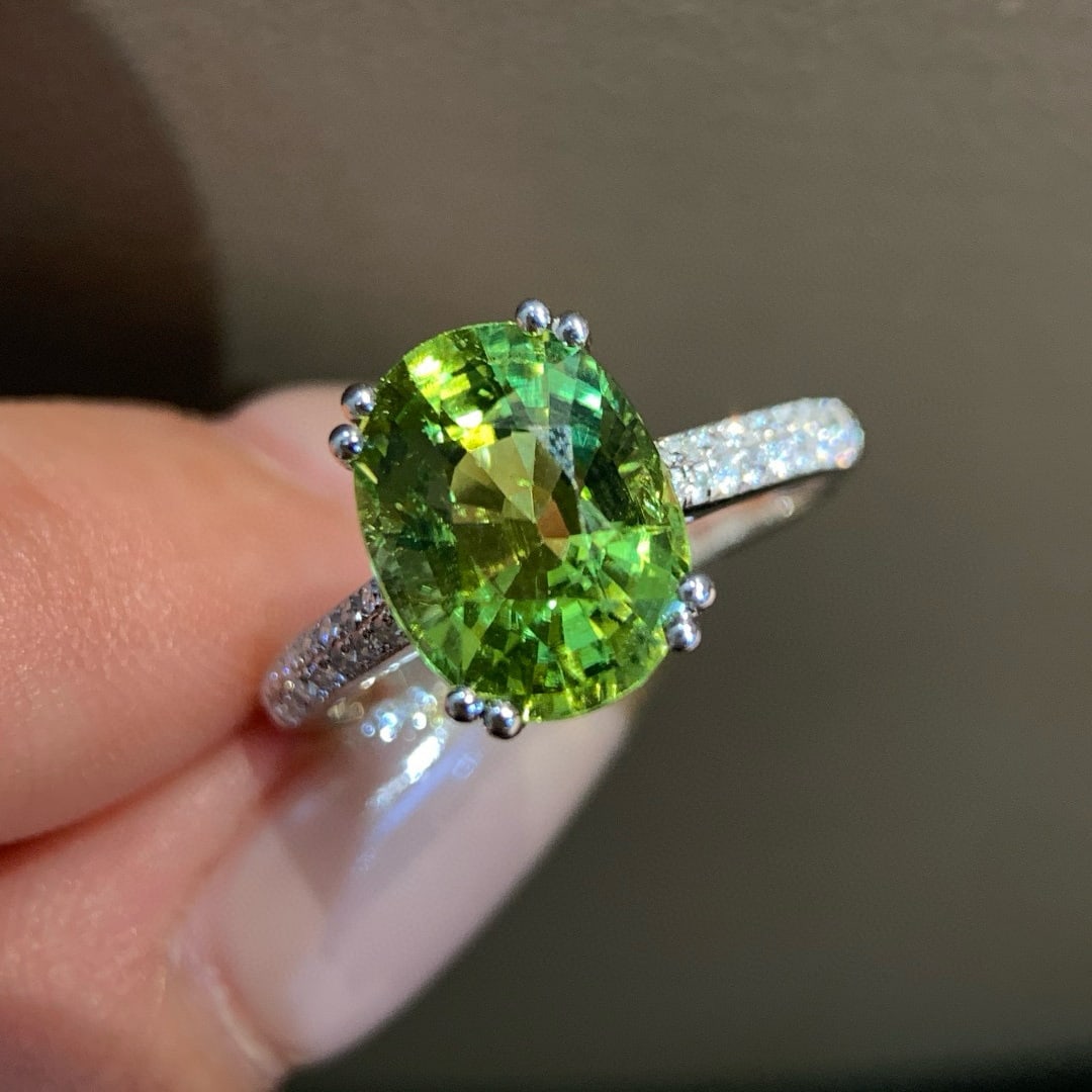14k Gold 3.47 Ct Natural Tourmaline & Diamond Ring: Ref:231036118 // gold content:14k gold // ring size:7. 25us // // main gemstone:tourmaline // shape:oval // carat weight:3. 47ct // color:green // treatment:natural // // adjacent gemstone 2 :