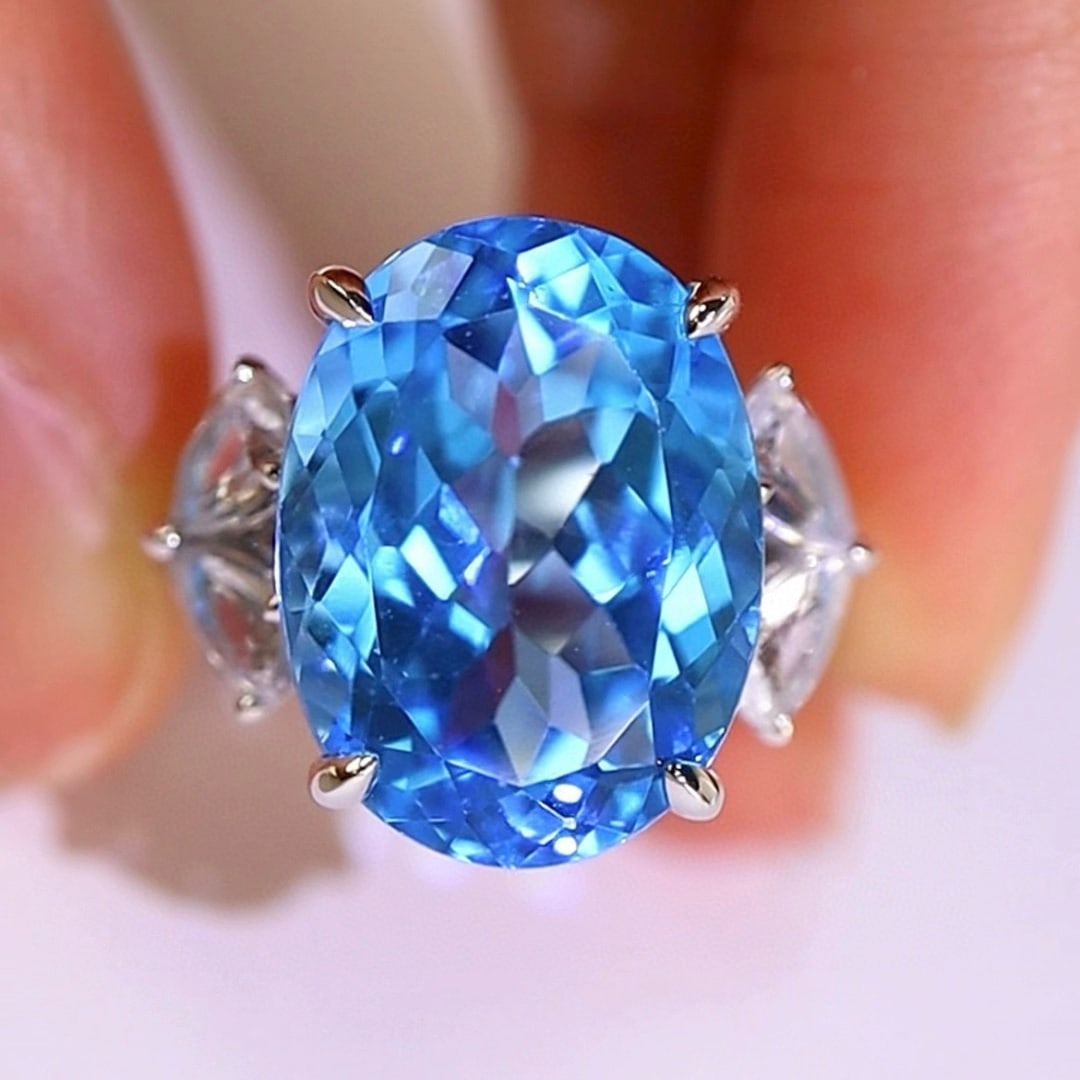 14k Gold 14.21 Ctw Natural Topaz & Sapphire Ring: Ref:231036350 // gold content:14k gold // ring size:7. 25us // // main gemstone:topaz // shape:oval // carat weight:12. 77ct // color:blue // treatment:natural // // adjacent gemstone 2 : sapphire //