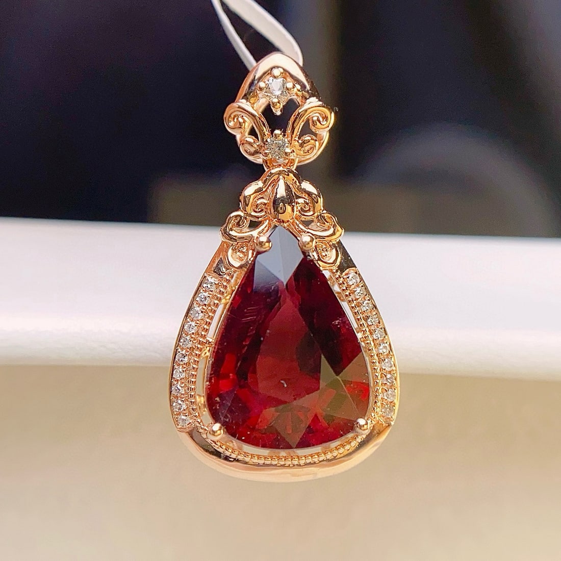 14k Gold 4.50 Ct Natural Tourmaline & Diamond & Sapphire Pendant( Without Chain ): Ref:231036432 // gold content:14k gold // main gemstone:tourmaline // shape:pear // carat weight:4. 50ct // color:red // treatment:natural // // adjacent gemstone 2 : diamond // number of stones:28