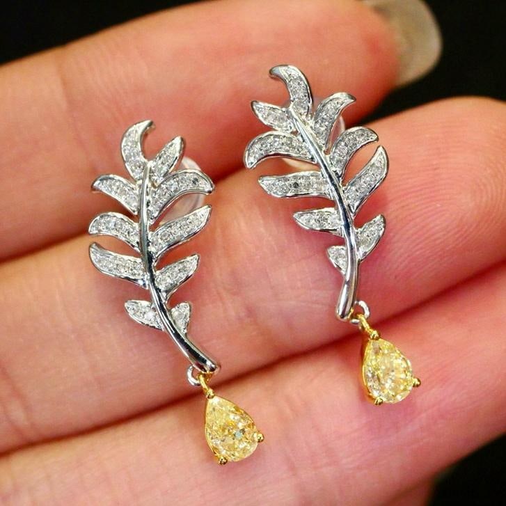 14k Gold 0.63 Ctw Natural Yellow Diamond & Diamond Earrings: Ref:231037019 // gold content:14k gold // main gemstone:yellow diamond // shape:pear // carat weight:0. 51ct // color:yellow // treatment:natural // // adjacent gemstone 2 : diamond // shape:round //