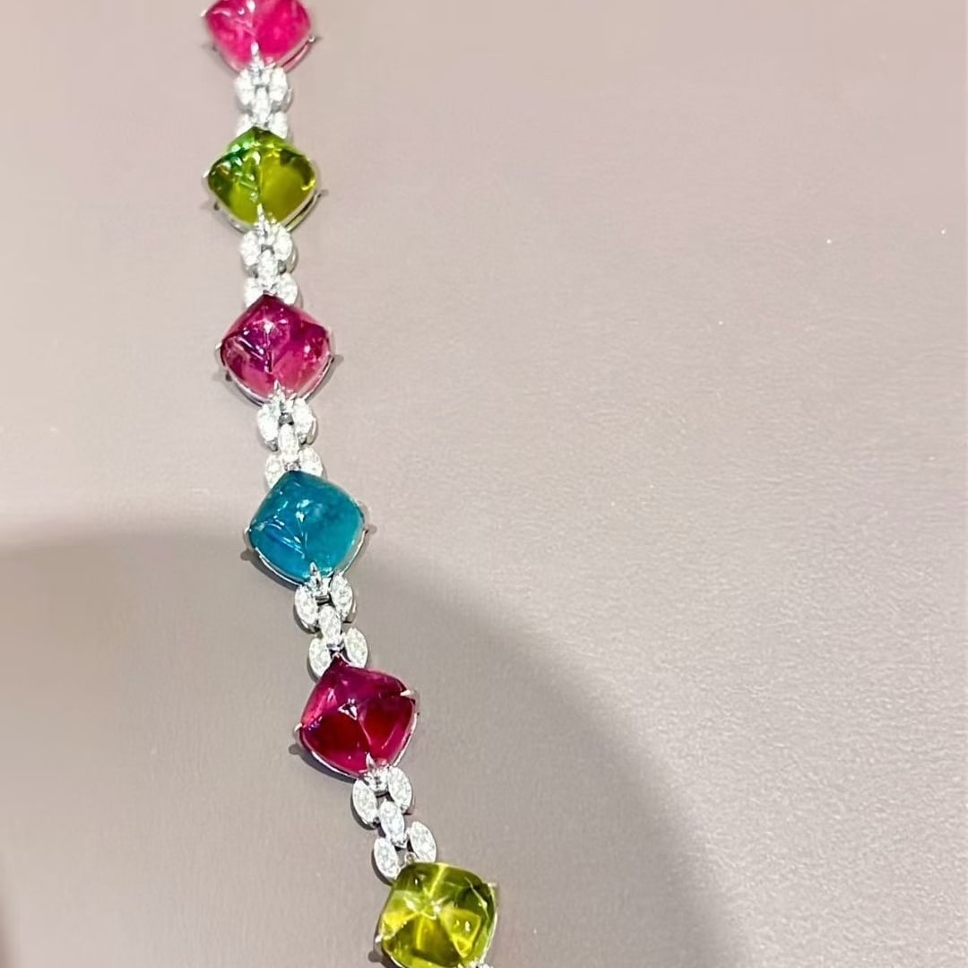 14k Gold 17.68 Ct Natural Tourmaline & Diamond Bracelet: Ref:231037056 // gold content:14k gold // main gemstone:tourmaline // shape:suger-loaf // carat weight:17. 68ct // color:color // treatment:natural // // adjacent gemstone 2 : diamond // shape:round