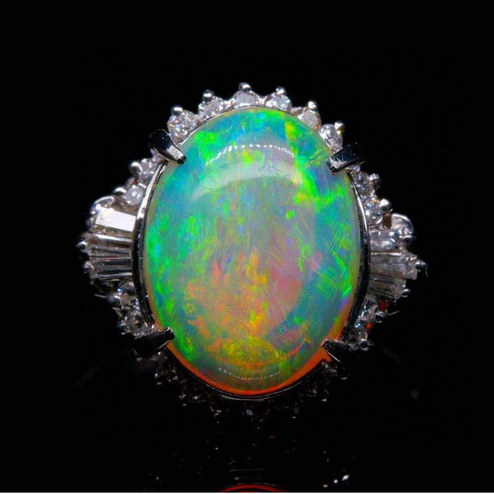 14k Gold 2.94 Ctw Natural Opal & Diamond Ring: Ref:231037062 // gold content:14k gold // ring size:7. 25us // // main gemstone:opal // shape:oval // carat weight:2. 61ct // color:color // treatment:natural // // adjacent gemstone 2 : diamond // sh