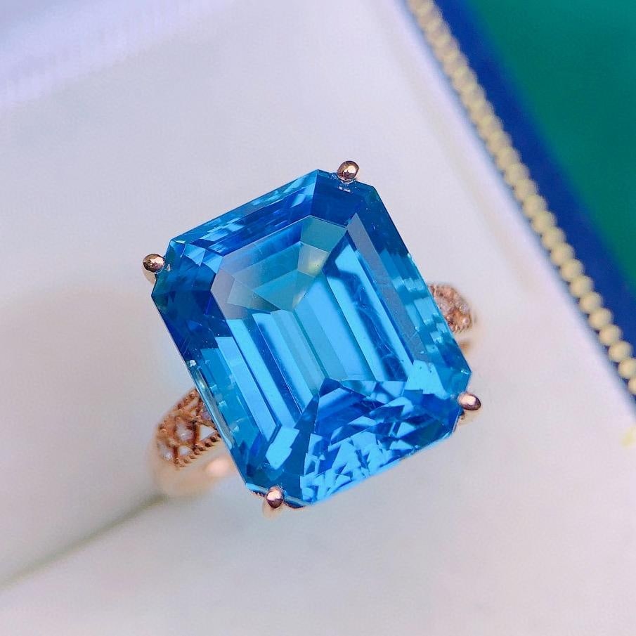 14k Gold 14.18 Ctw Natural Topaz & Diamond Ring: Ref:231037094 // gold content:14k gold // ring size:7. 25us // // main gemstone:topaz // shape:octagonal // carat weight:14. 15ct // color:blue // treatment:natural // // adjacent gemstone 2 :