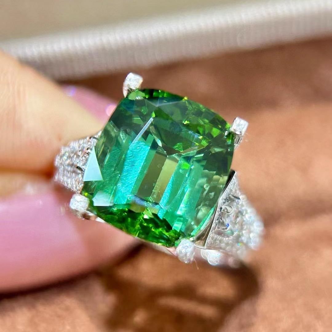 14k Gold 7.94 Ctw Natural Tourmaline & Diamond Ring: Ref:231037114 // gold content:14k gold // ring size:7. 25us // // main gemstone:tourmaline // shape:cushion // carat weight:7. 37ct // color:green // treatment:natural // // adjacent gemstone 2 : diam