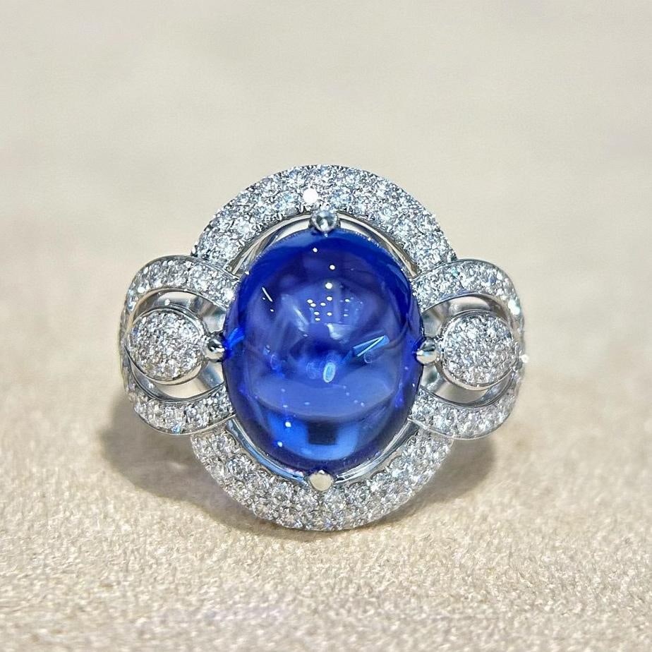 14k Gold 8.22 Ctw Natural Tanzanite & Diamond Ring: Ref:231037117 // gold content:14k gold // ring size:7. 25us // // main gemstone:tanzanite // shape:oval // carat weight:7. 43ct // color:blue // treatment:natural // // adjacent gemstone 2 : diamond /