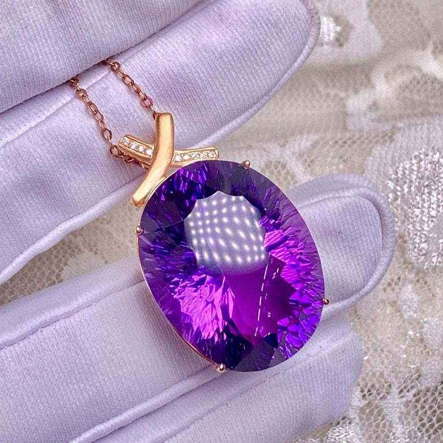 14k Gold 34.1 Ct Natural Amethyst & Diamond Pendant( Without Chain ): Ref:231037129 // gold content:14k gold // main gemstone:amethyst // shape:oval // carat weight:34. 1ct // color:purple // treatment:natural // // adjacent gemstone 2 : diamond // number of stones:9