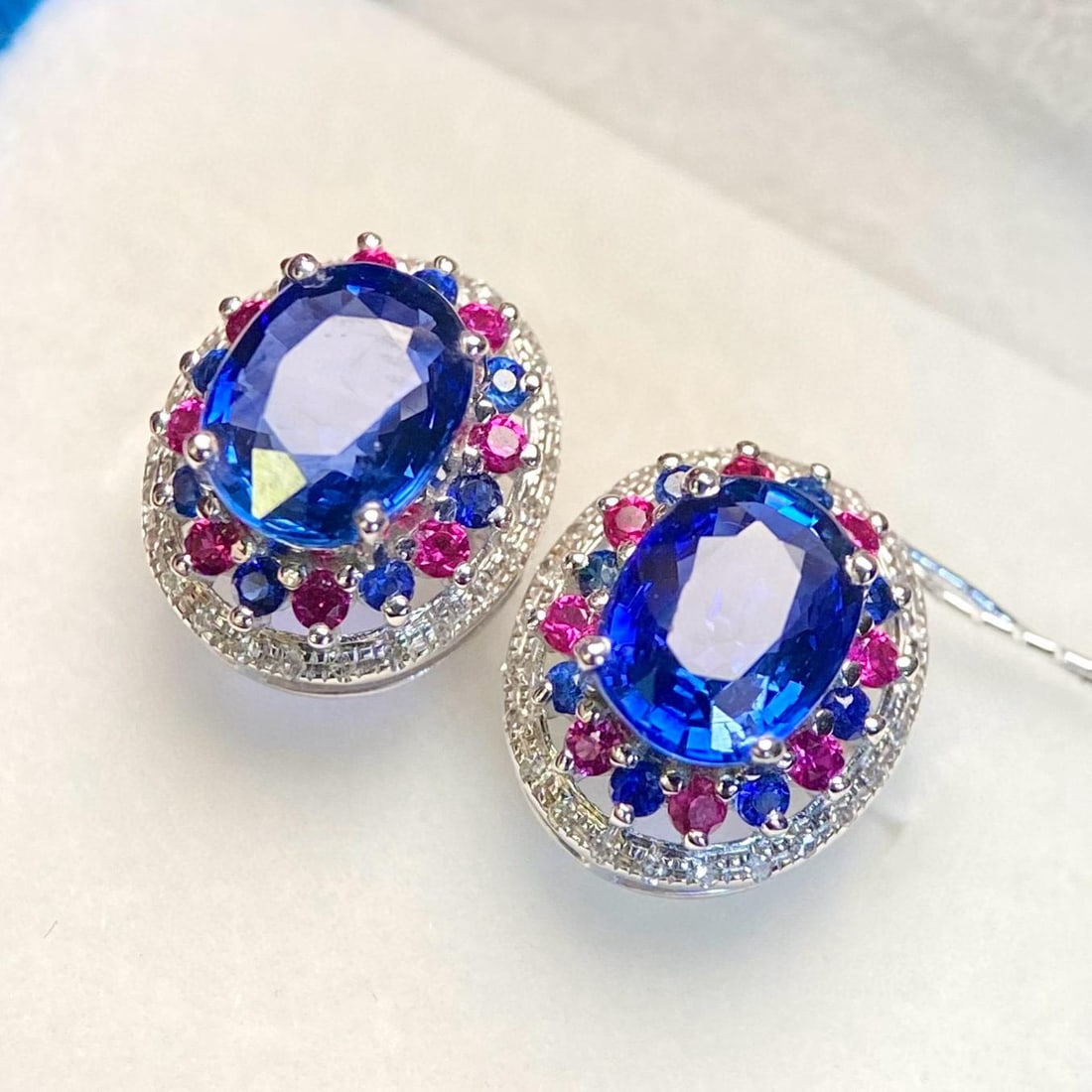 14k Gold 2.15 Ct Natural Sapphire & Diamond Earrings: Ref:231037137 // gold content:14k gold // main gemstone:sapphire // shape:oval // carat weight:2. 15ct // color:blue // treatment:natural // // adjacent gemstone 2 : diamond // number of stones:82 // 