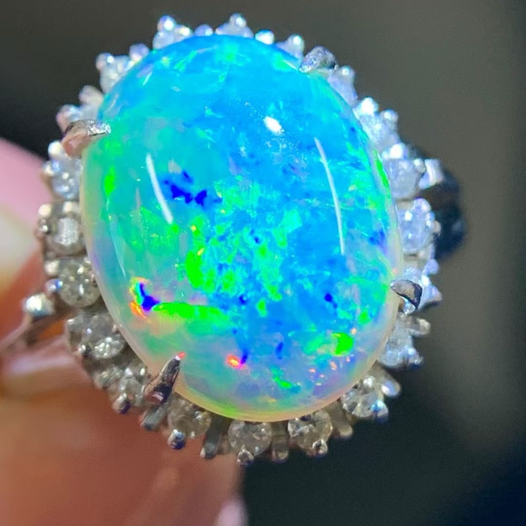 14k Gold 2.93 Ctw Natural Opal & Diamond Ring: Ref:231037171 // gold content:14k gold // ring size:7. 25us // // main gemstone:opal // shape:oval // carat weight:2. 69ct // color:color // treatment:natural // // adjacent gemstone 2 : diamond //