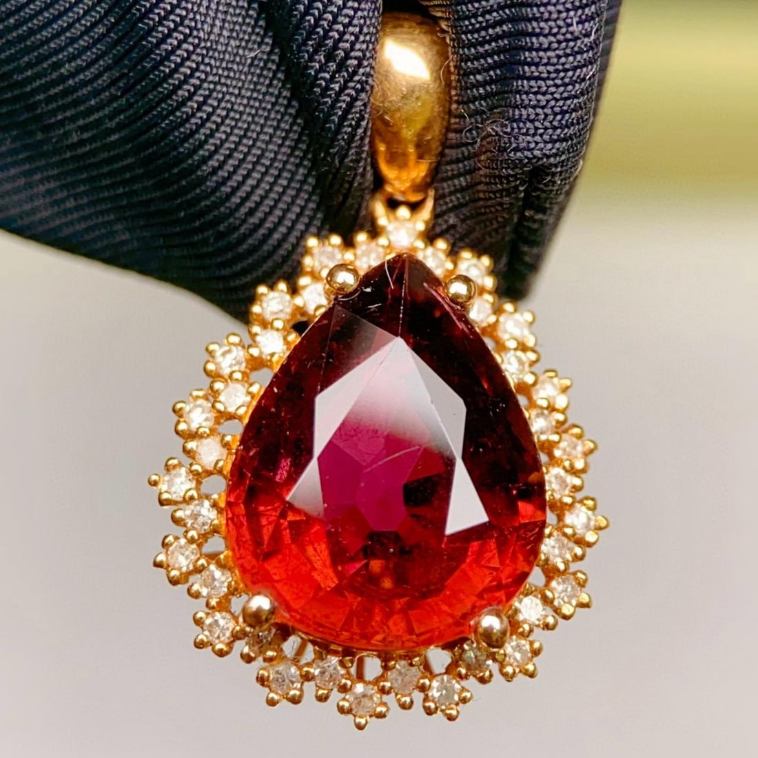 14k Gold 4.08 Ctw Natural Tourmaline & Diamond Pendant( Without Chain ): Ref:231037202 // gold content:14k gold // main gemstone:tourmaline // shape:pear // carat weight:3. 9ct // color:red // treatment:natural // // adjacent gemstone 2 : diamond // number of stones:36 //