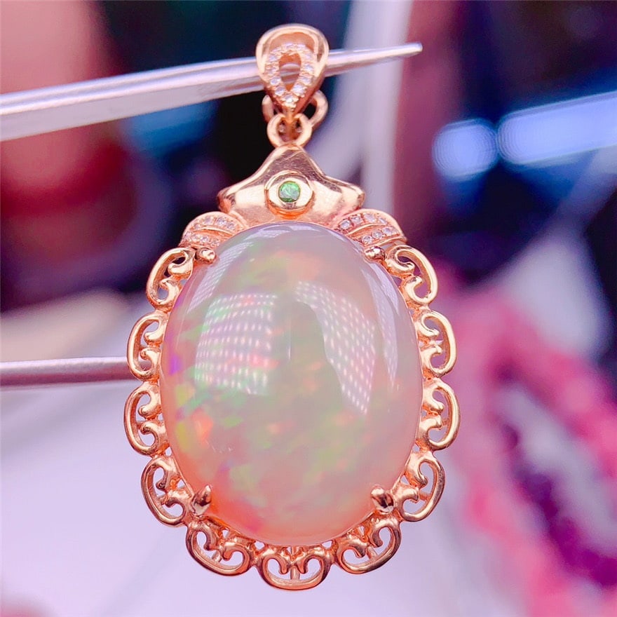 14k Gold 18.01 Ct Natural Opal & Diamond & Tsavorite Pendant( Without Chain ): Ref:231038031 // gold content:14k gold // main gemstone:opal // shape:oval // carat weight:18. 01ct // color:color // treatment:natural // // adjacent gemstone 2 : diamond // shape:round // clarity