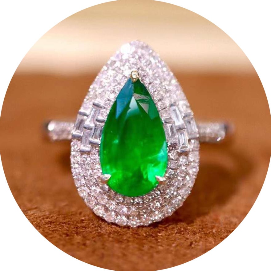 14k Gold 2.15 Ctw Vivid Green Natural Emerald & Diamond Ring: Ref:231038050 // gold content:14k gold // ring size:7. 25us // // main gemstone:emerald // shape:pear // carat weight:1. 60ct // color:vivid green // treatment:natural // // adjacent gemstone 2 : diam
