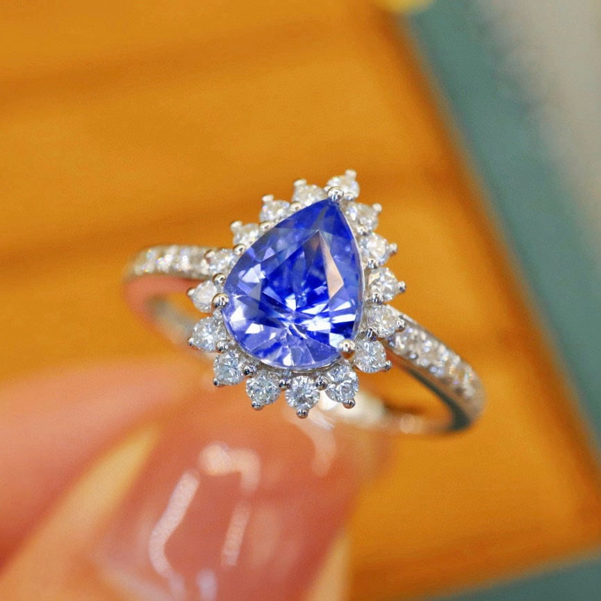 14k Gold 1.71 Ctw Natural Sapphire & Diamond Ring: Ref:231038077 // gold content:14k gold // ring size:7. 25us // // main gemstone:sapphire // shape:pear // carat weight:1. 36ct // color:blue // treatment:natural // // adjacent gemstone 2 : diamond