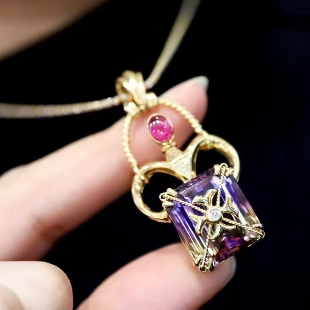 14k Gold 18.74 Ctw Natural Amethyst & Ruby Pendant( Without Chain ): Ref:231038092 // gold content:14k gold // main gemstone:amethyst // shape:octagonal // carat weight:18. 12ct // color:purple // treatment:natural // // adjacent gemstone 2 : ruby // shape:oval //