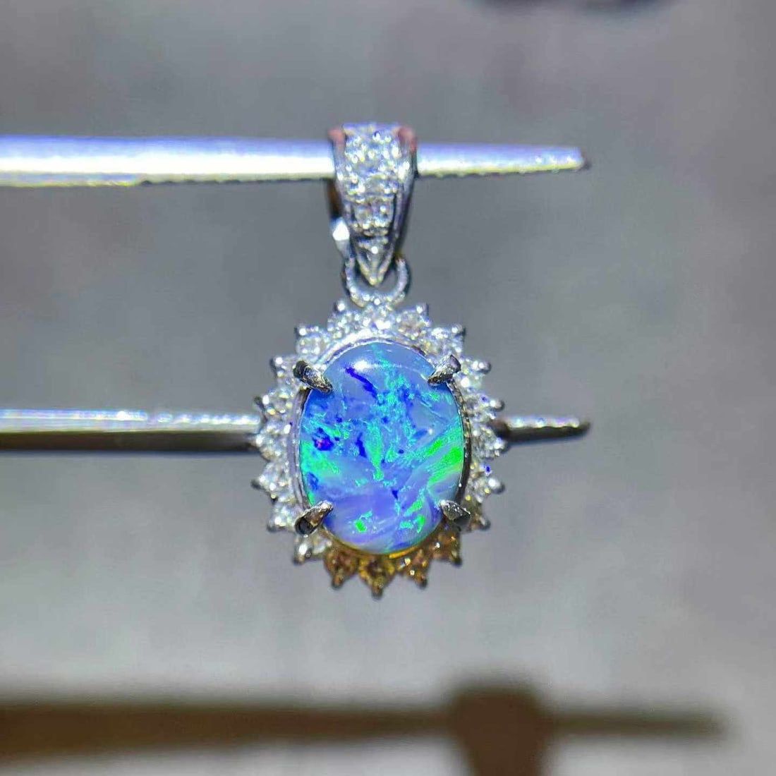 14k Gold 1.58 Ctw Natural Opal & Diamond Pendant( Without Chain ): Ref:231038107 // gold content:14k gold // main gemstone:opal // shape:oval // carat weight:1. 30ct // color:color // treatment:natural // // adjacent gemstone 2 : diamond // shape:round // carat