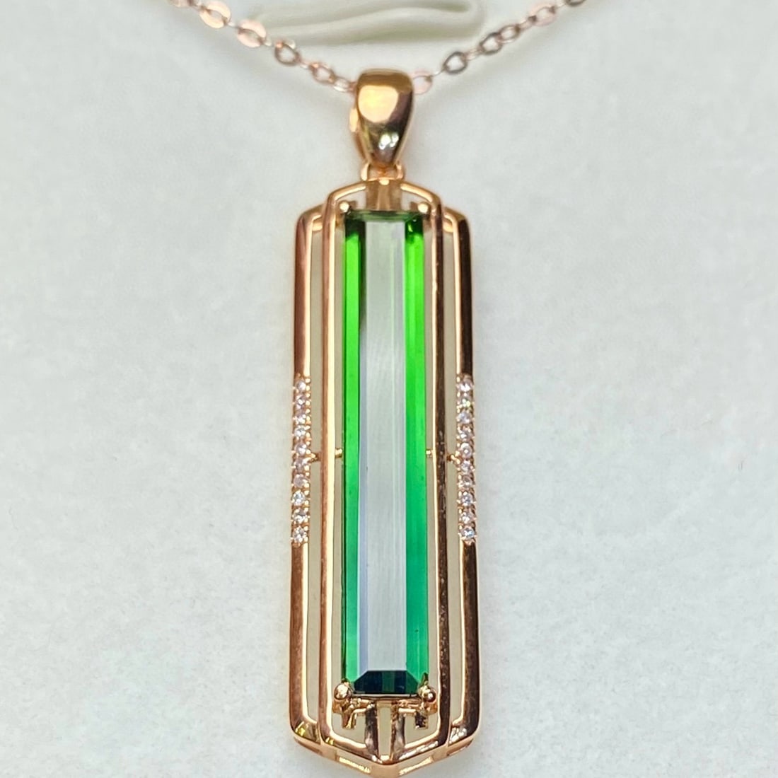 14k Gold 2.55 Ct Natural Tourmaline & Diamond Pendant( Without Chain ): Ref:231038109 // gold content:14k gold // main gemstone:tourmaline // shape:rectangle // carat weight:2. 55ct // color:green // treatment:natural // // adjacent gemstone 2 : diamond // number of