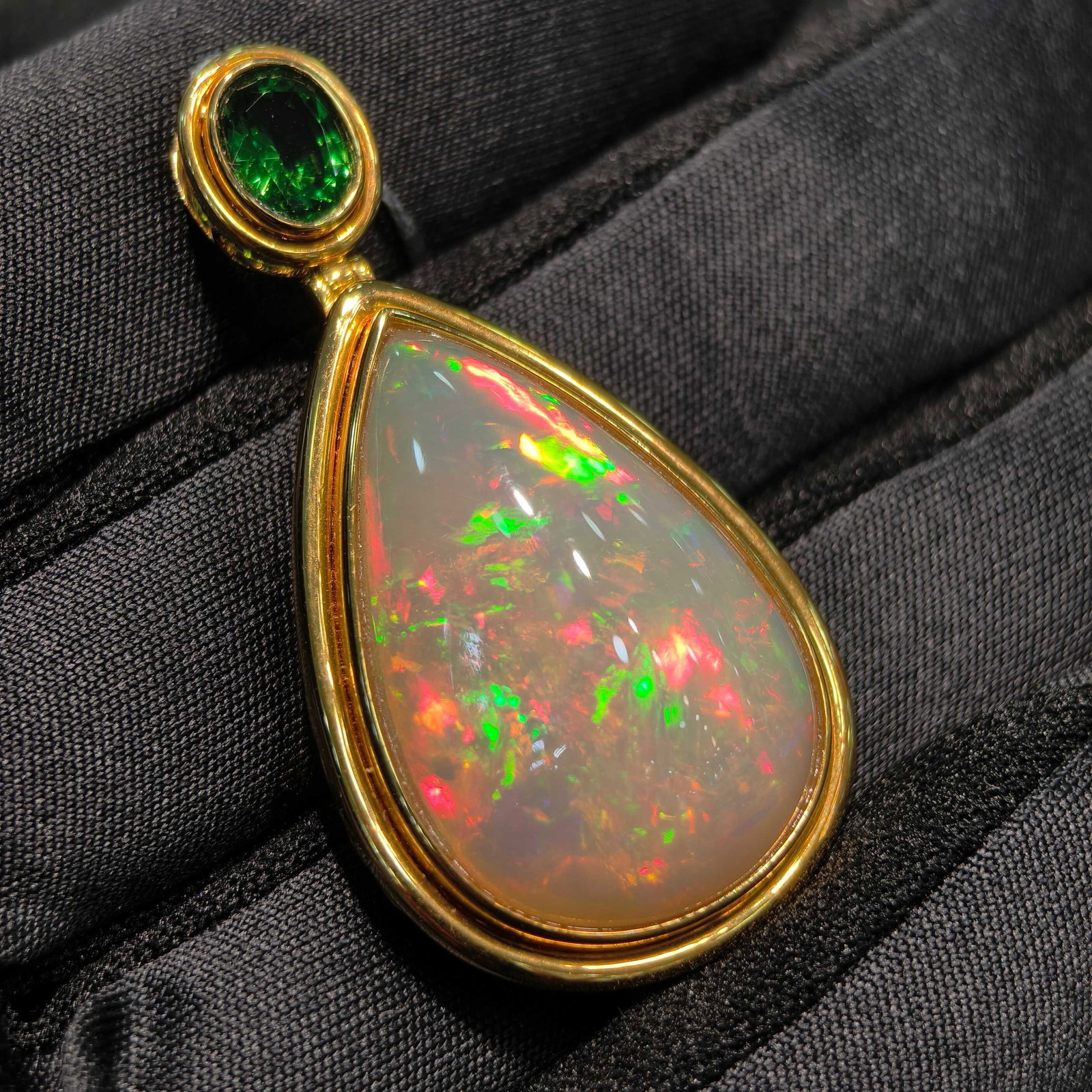 14k Gold 21.55 Ctw Natural Opal & Tourmaline Pendant( Without Chain ): Ref:231038282 // gold content:14k gold // main gemstone:opal // shape:pear // carat weight:20. 7ct // color:color // treatment:natural // // adjacent gemstone 2 : tourmaline // shape:oval // carat