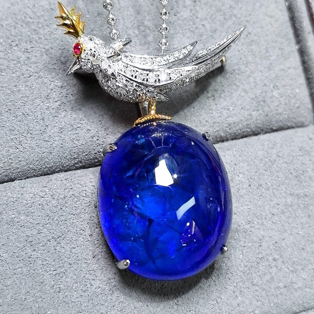 14k Gold 39.48 Ctw Natural Tanzanite & Diamond Pendant( Without Chain ): Ref:231038313 // gold content:14k gold // main gemstone:tanzanite // shape:oval // carat weight:38. 61ct // color:blue // treatment:natural // // adjacent gemstone 2 : diamond // shape:round // carat